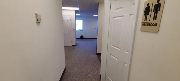 a view of a hallway with washer and dryer