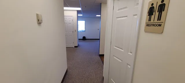 a view of a hallway with washer and dryer