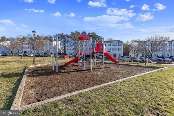 a view of a park with swings and slides
