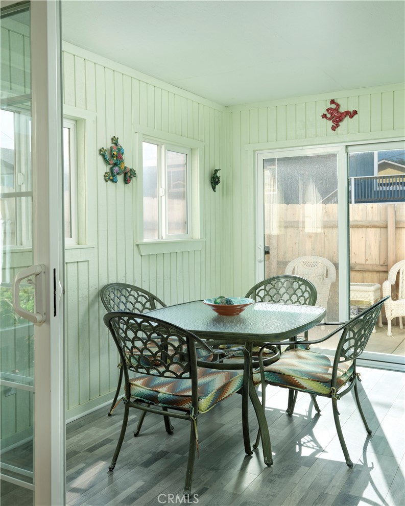 310 Sandpiper Lane Oceano, CA 93445 - Photo 7 of 40 Downstairs sunroom with access to outdoor patio and BBQ area