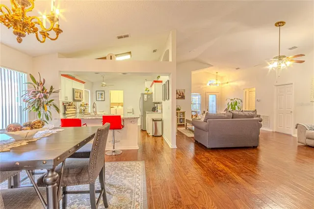 a room with lots of wooden furniture and white walls