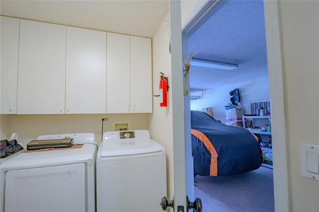 a view of utility room and bedroom