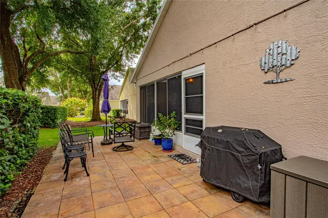 a view of a chairs and table in a patio