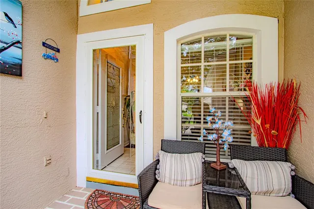 a view of a two chairs in the porch