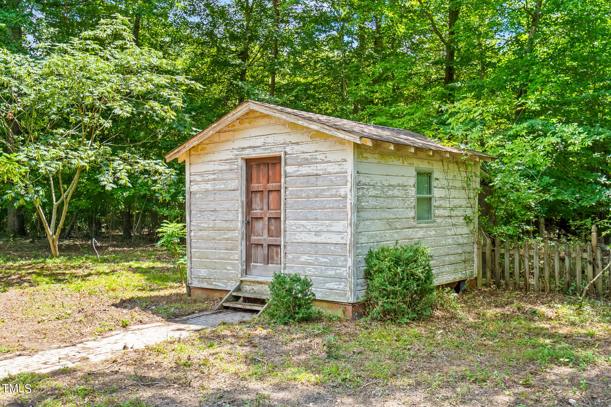 1875 Wilson Road Bennett, NC 27208 - Photo 27 of 70 a view of a backyard with plants and large trees