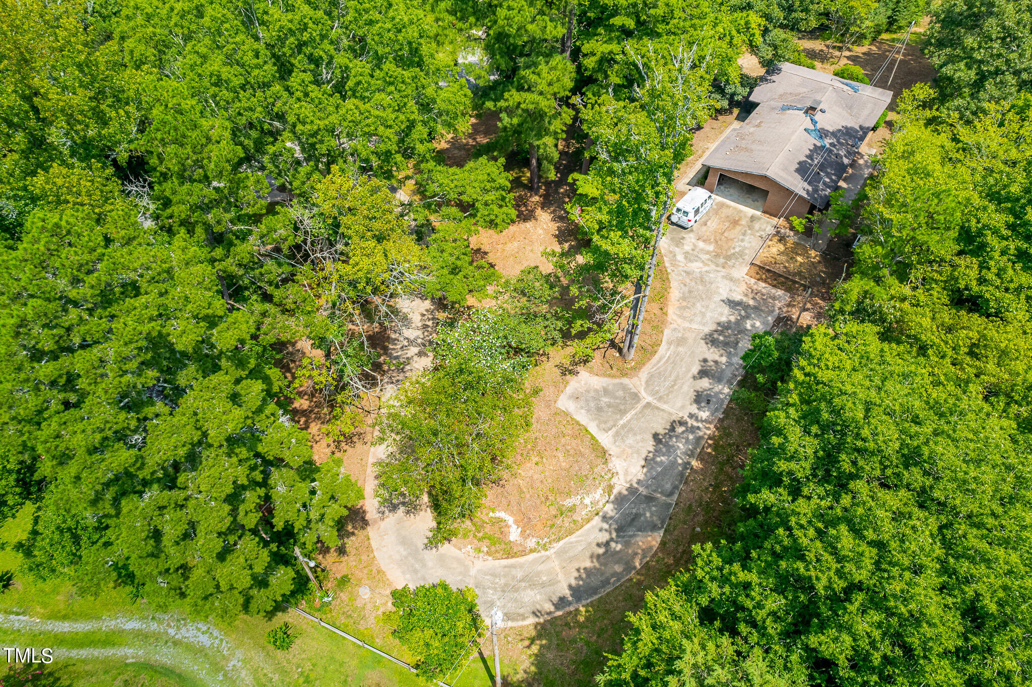 1875 Wilson Road Bennett, NC 27208 - Photo 35 of 70 an aerial view of a house with a yard and large trees