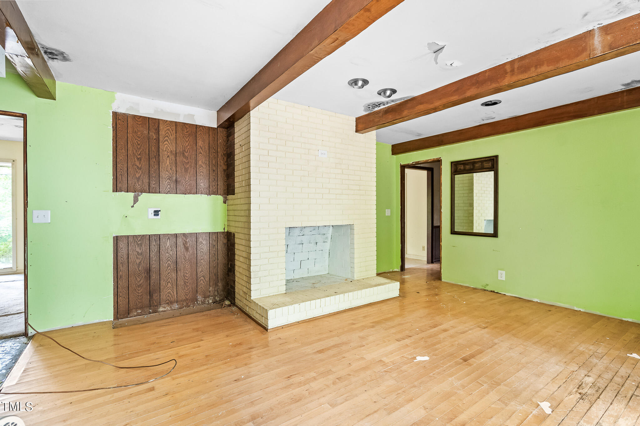 1875 Wilson Road Bennett, NC 27208 - Photo 55 of 70 a view of an empty room with a fireplace and a window