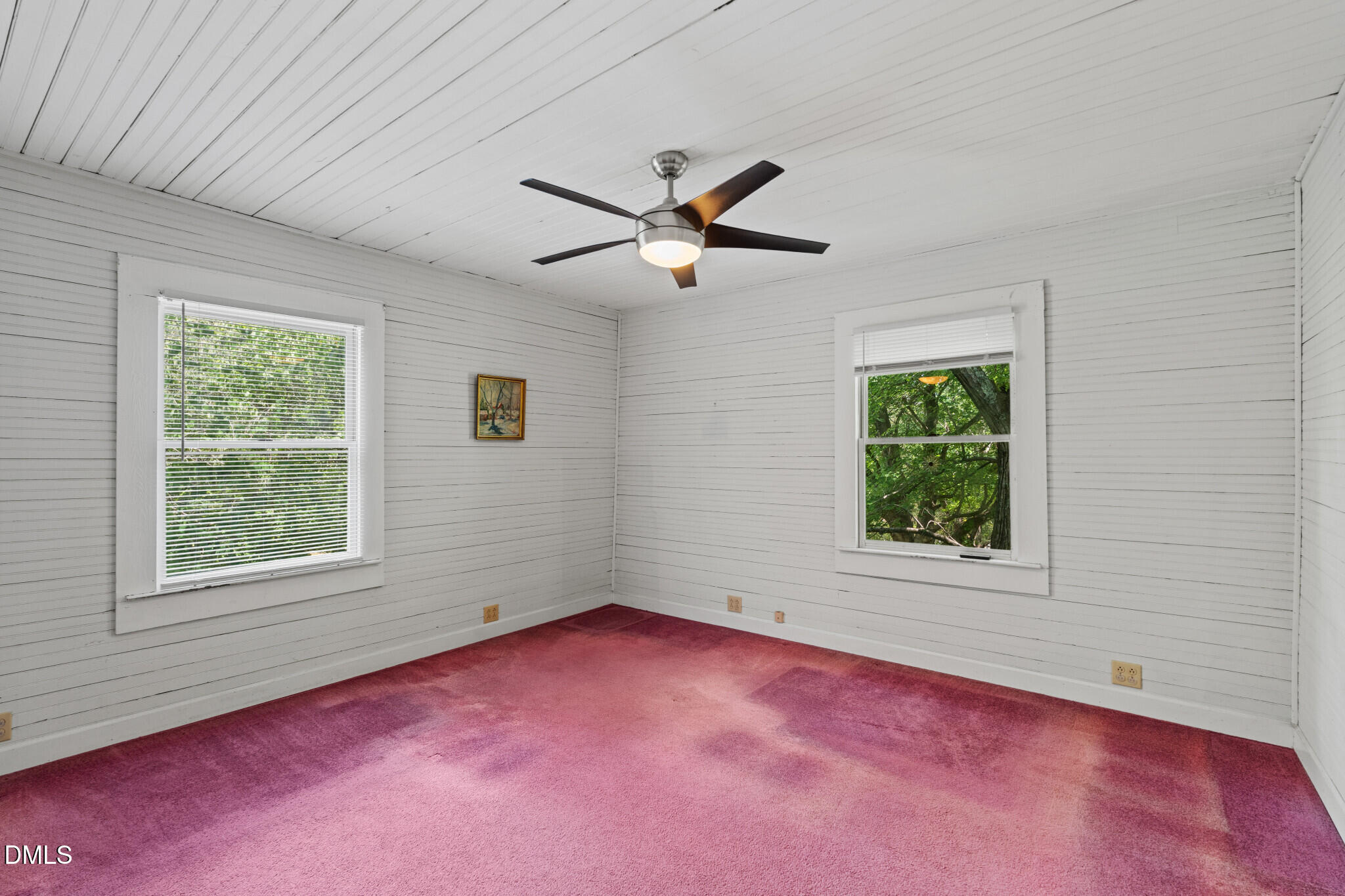 3415 Mt Willing Road Efland, NC 27243 - Photo 18 of 36 an empty room with a window and a fan