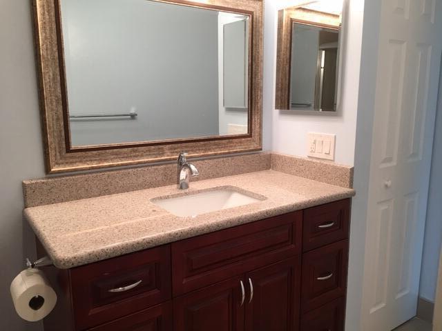 4154 Inverrary Drive, Unit 407 Lauderhill, FL 33319 - Photo 11 of 39 a bathroom with a sink and a mirror