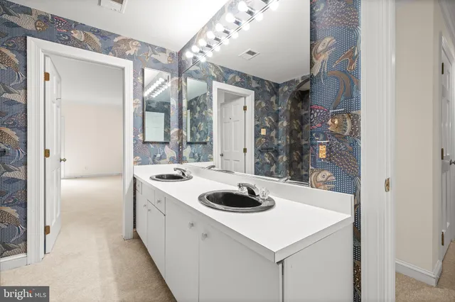 a kitchen with a sink a stove and cabinets