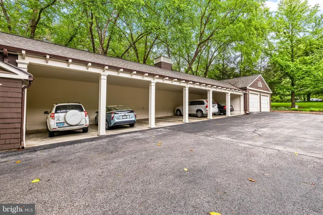 a view of a car park in front of house