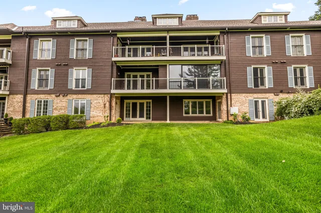 a large building with a garden view