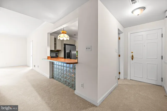 a view of hall way with mirror