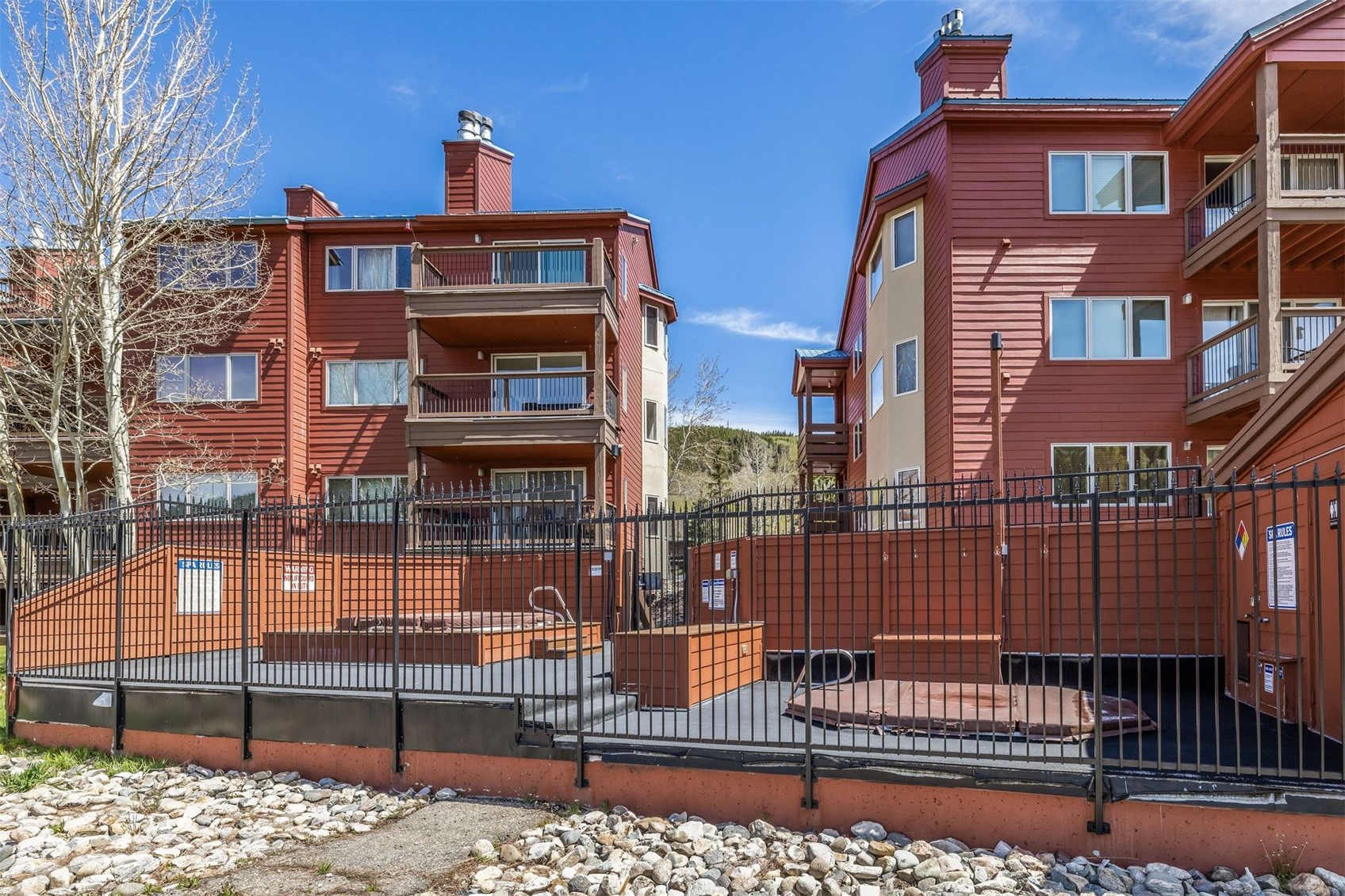 60 Oro Grande Road, Unit 204 Keystone, CO 80435 - Photo 21 of 50 a front view of a house with a fence
