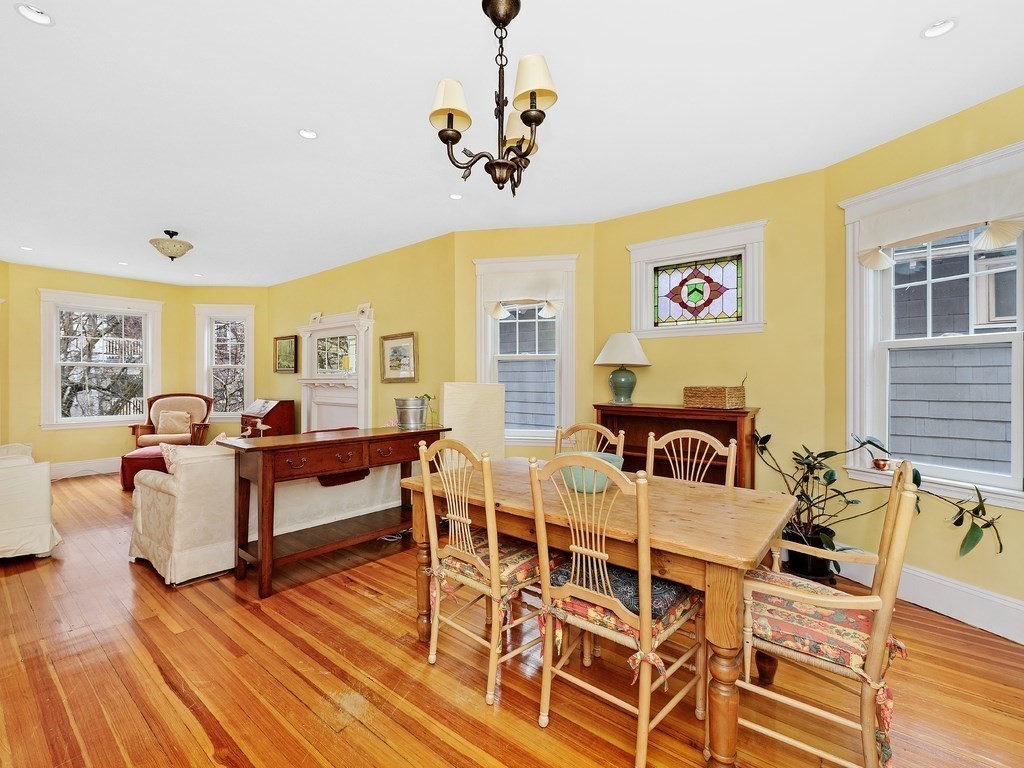106 Browne Street, Unit 2 Brookline, MA 02446 - Photo 1 of 1 a living room with lots of furniture and a wooden floor