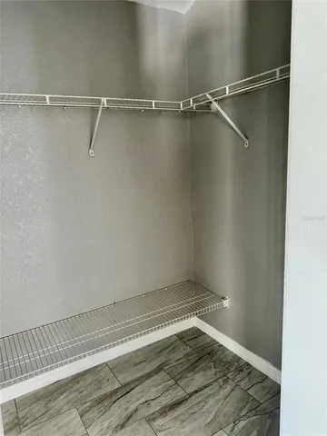 a view of an empty walk in closet