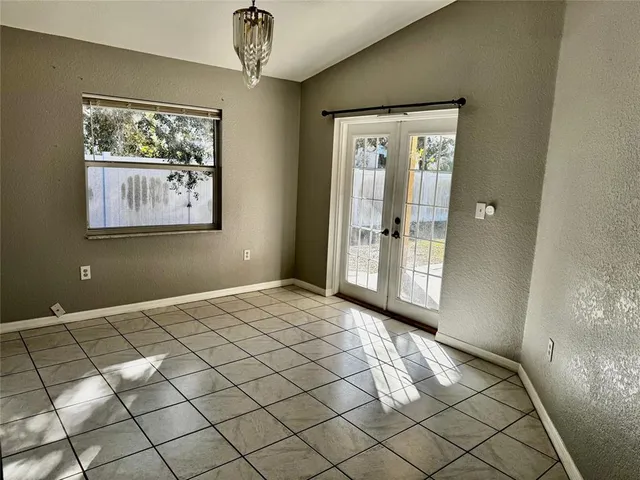 a view of an empty room and window