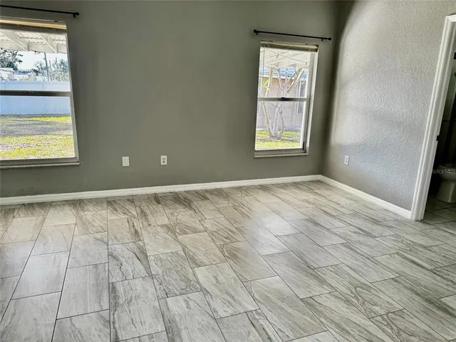 a view of an empty room and window