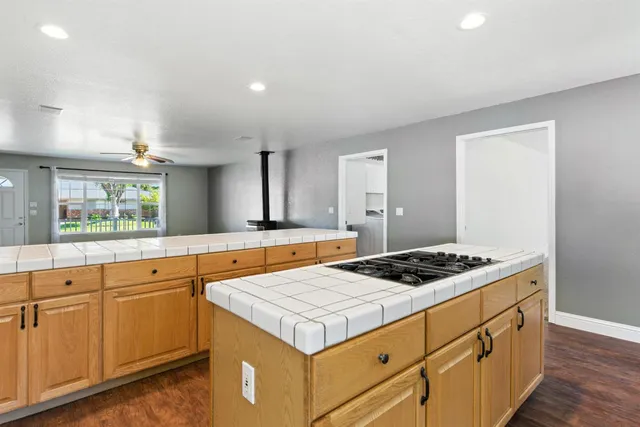 a kitchen that has a sink and a stove