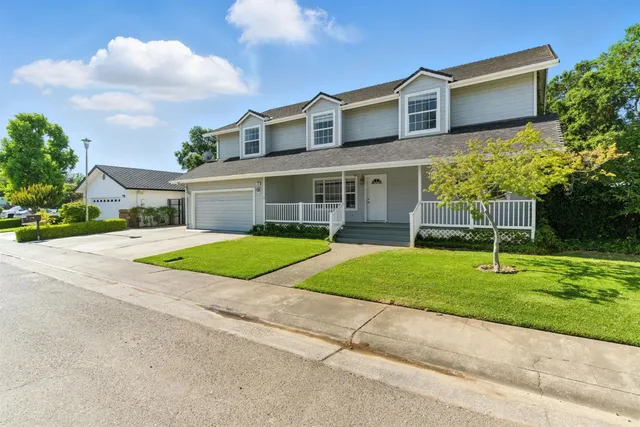 a view of house with outdoor space and entertaining space