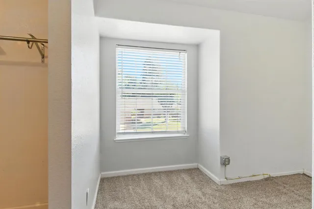 a view of an empty walk in closet