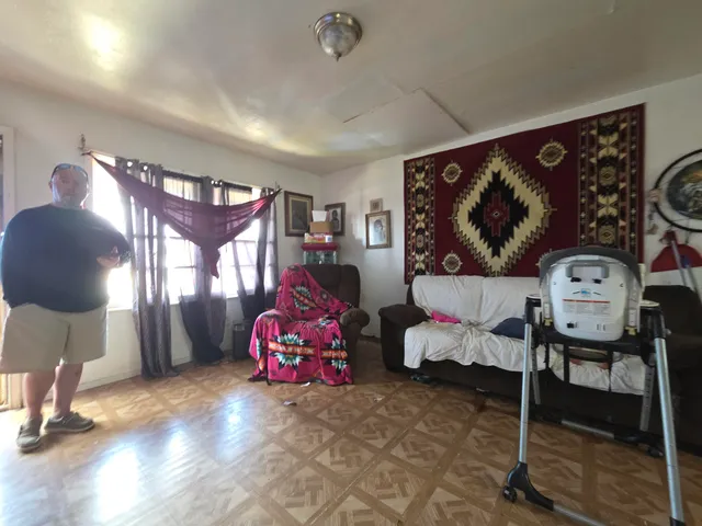 a bedroom with furniture and a window