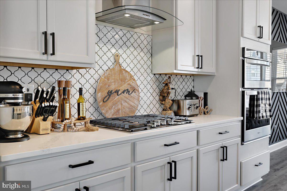 21 Greensborough Road Reisterstown, MD 21136 - Photo 13 of 54 a kitchen with white cabinets and appliances