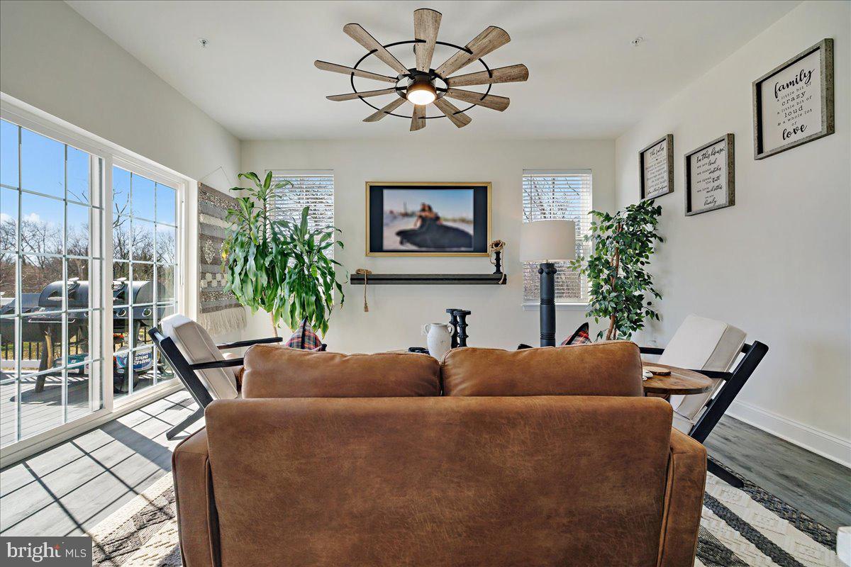 21 Greensborough Road Reisterstown, MD 21136 - Photo 16 of 54 a living room with furniture a chandelier and a window