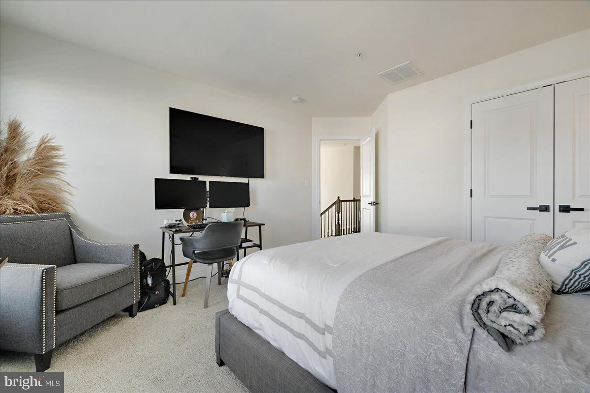 21 Greensborough Road Reisterstown, MD 21136 - Photo 22 of 54 a bedroom with a bed and a flat screen tv