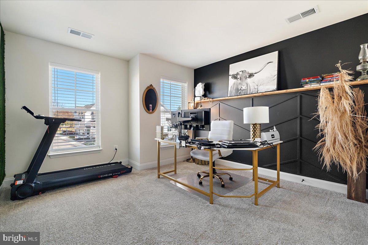 21 Greensborough Road Reisterstown, MD 21136 - Photo 23 of 54 a living room with furniture and a flat screen tv