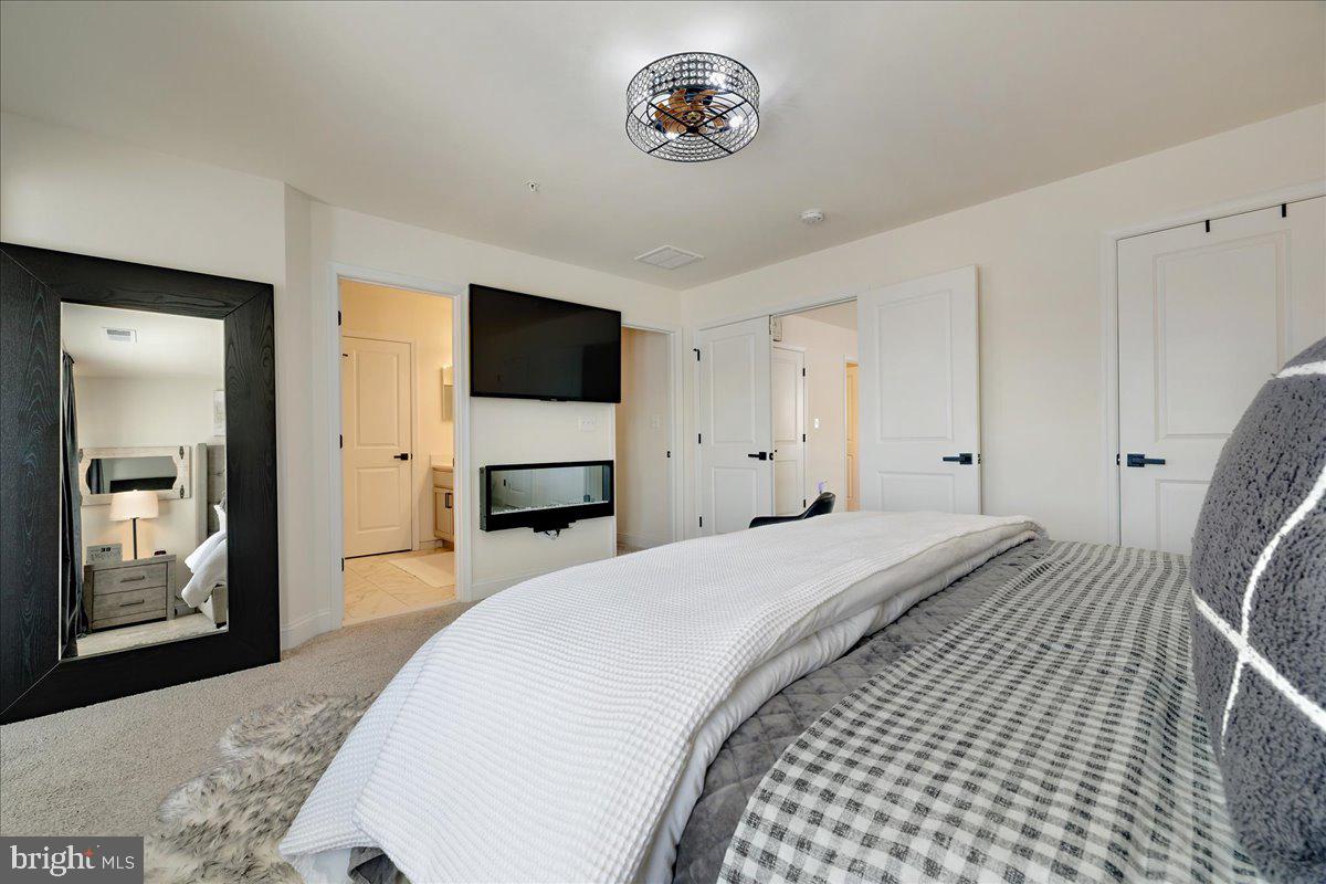 21 Greensborough Road Reisterstown, MD 21136 - Photo 29 of 54 a bedroom with a bed and a flat screen tv