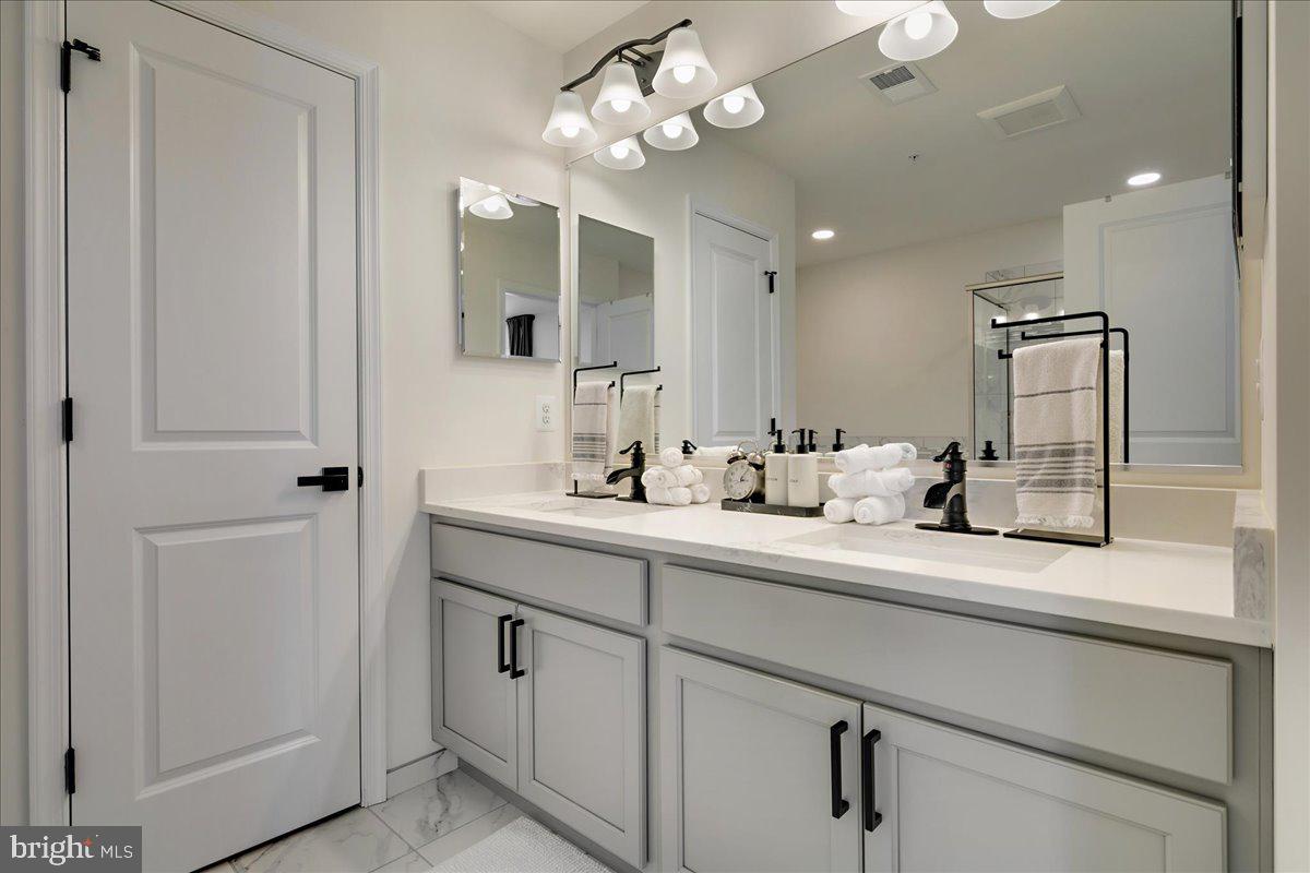 21 Greensborough Road Reisterstown, MD 21136 - Photo 30 of 54 a bathroom with a sink vanity and mirror