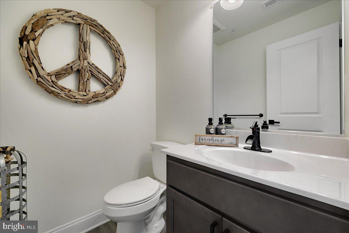 21 Greensborough Road Reisterstown, MD 21136 - Photo 35 of 54 a bathroom with a sink and a mirror