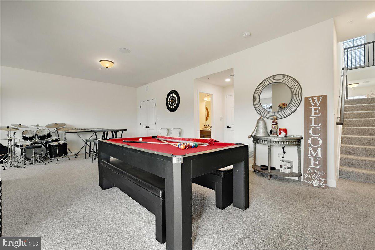 21 Greensborough Road Reisterstown, MD 21136 - Photo 37 of 54 a living room with a large window and a table with chairs