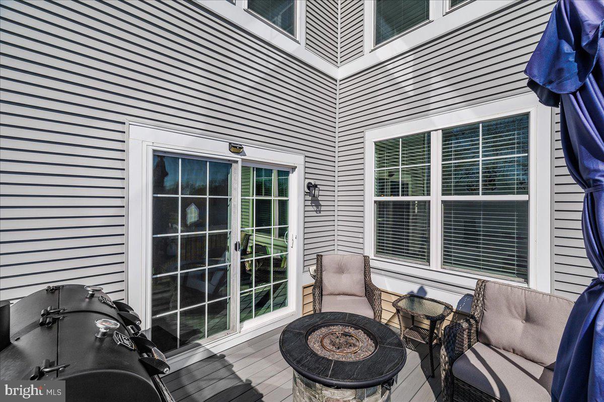 21 Greensborough Road Reisterstown, MD 21136 - Photo 44 of 54 a view of a house with a barbeque and a large window