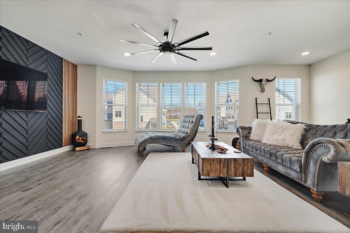21 Greensborough Road Reisterstown, MD 21136 - Photo 5 of 54 a living room with furniture and a flat screen tv