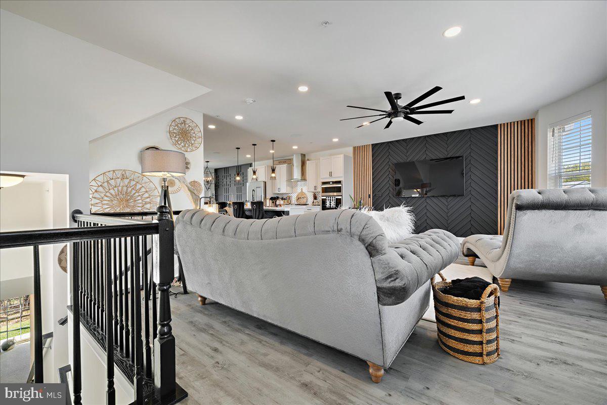 21 Greensborough Road Reisterstown, MD 21136 - Photo 8 of 54 a living room with furniture fireplace and wooden floor