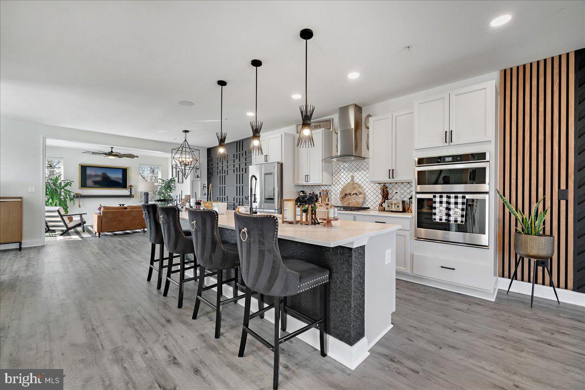 21 Greensborough Road Reisterstown, MD 21136 - Photo 10 of 54 a large kitchen with lots of counter space a sink appliances and dining table