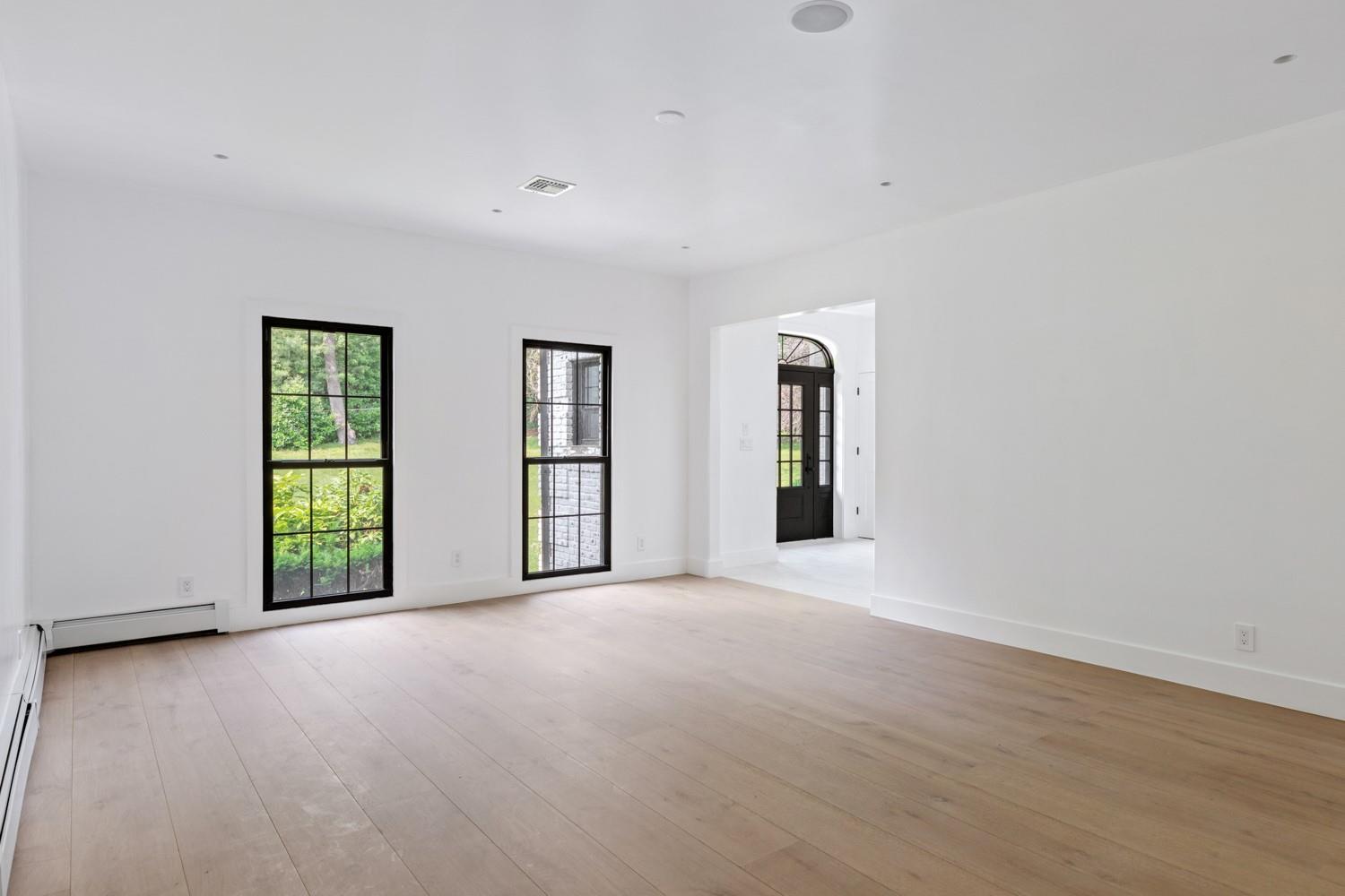 33 High Farms Road Glen Head, NY 11545 - Photo 15 of 35 Dining room with plenty of natural light, light wood finished floors, a baseboard radiator, and baseboard heating