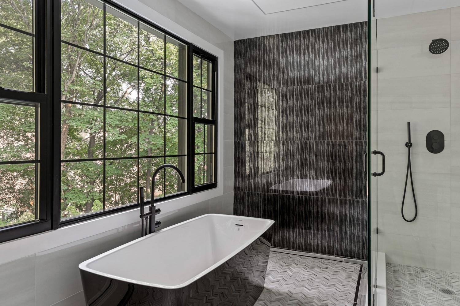 33 High Farms Road Glen Head, NY 11545 - Photo 21 of 35 Full bathroom featuring plenty of natural light, a stall shower, a freestanding tub, and tile walls