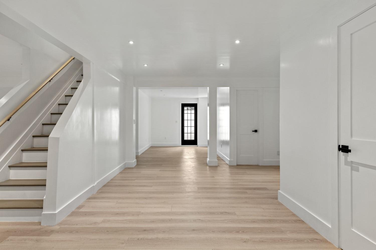 33 High Farms Road Glen Head, NY 11545 - Photo 29 of 35 Basement featuring stairs, light wood-style flooring, and recessed lighting