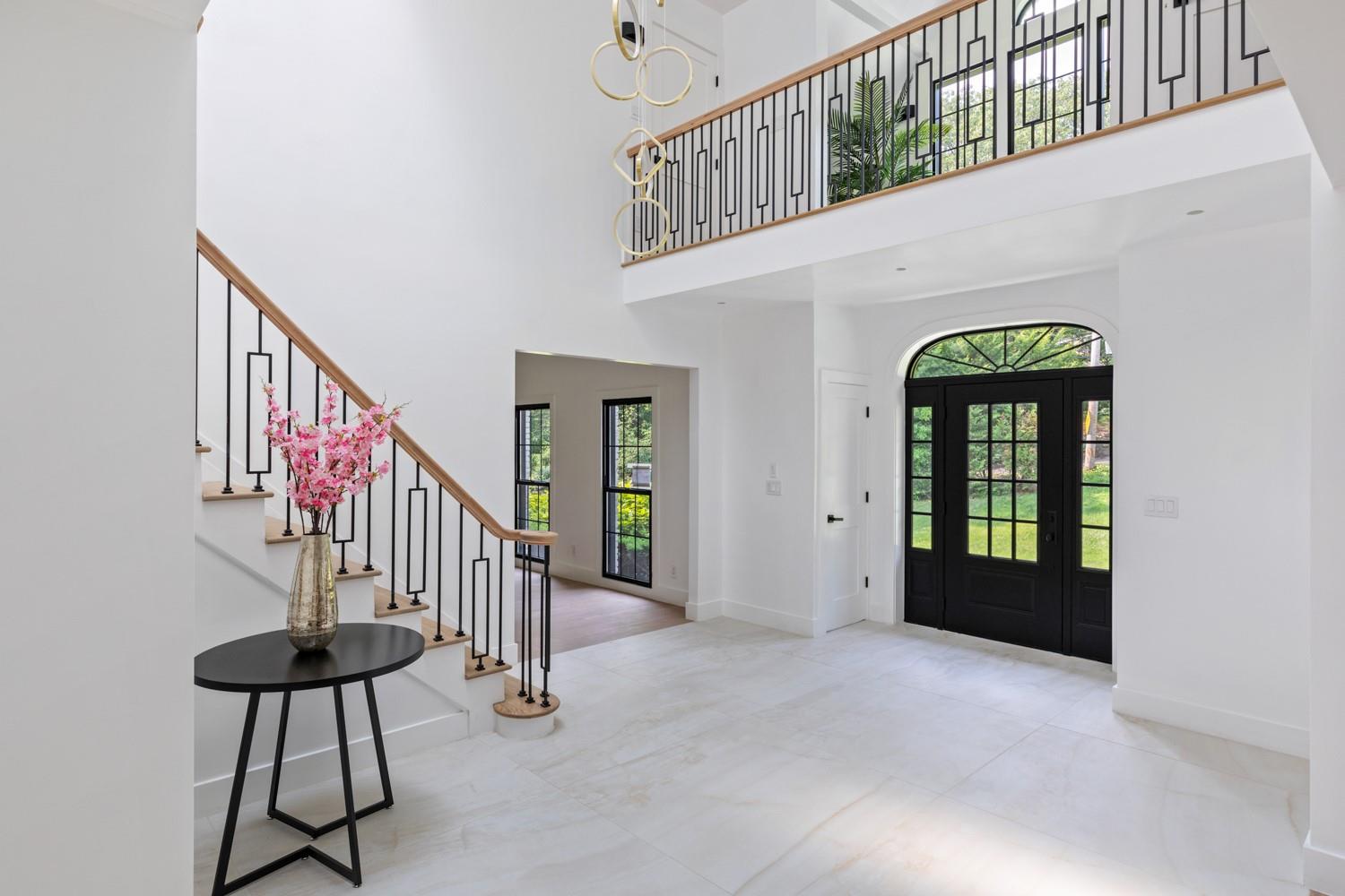33 High Farms Road Glen Head, NY 11545 - Photo 8 of 35 Entryway featuring a high ceiling and stairway