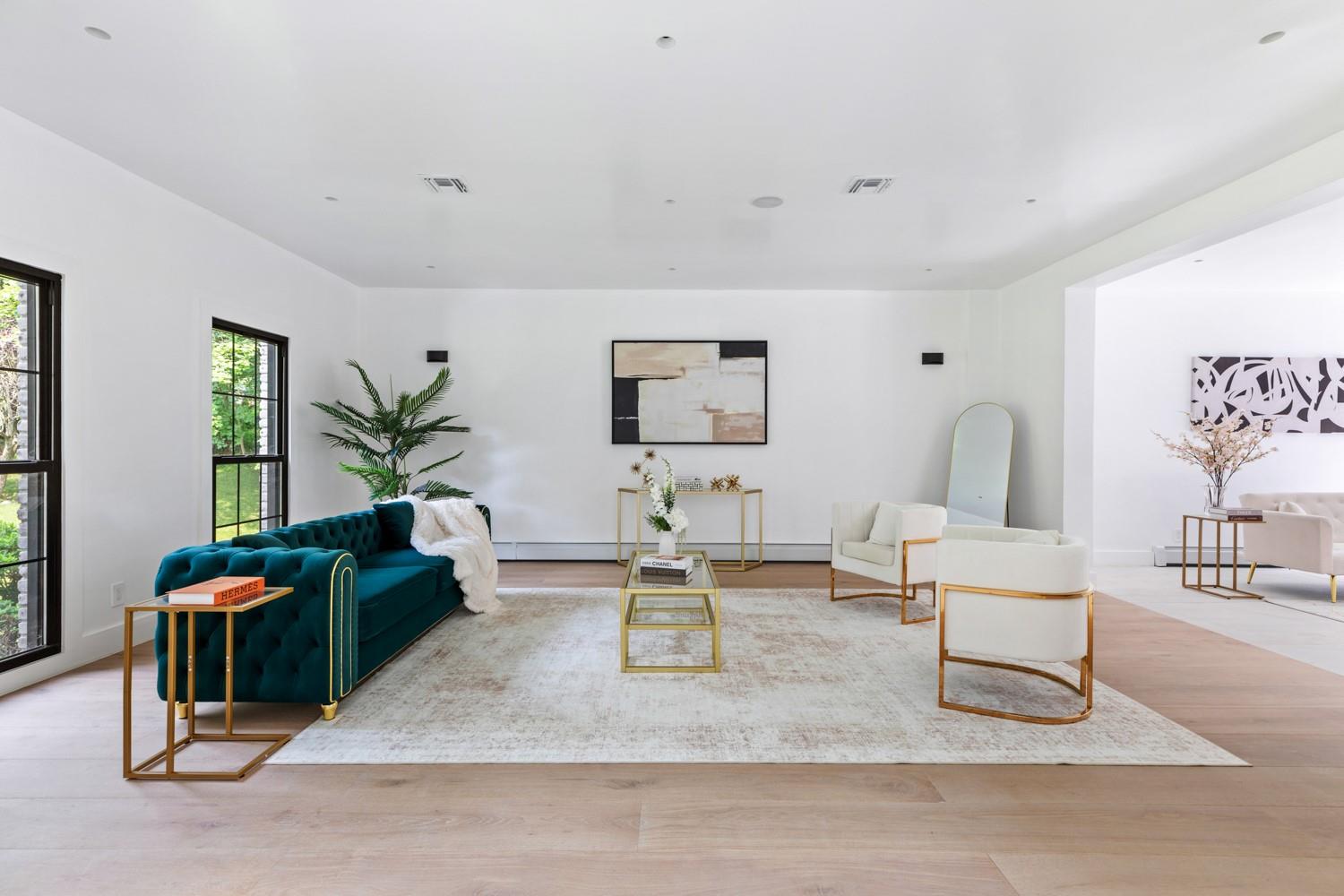 33 High Farms Road Glen Head, NY 11545 - Photo 9 of 35 Living area featuring light wood finished floors and a baseboard radiator