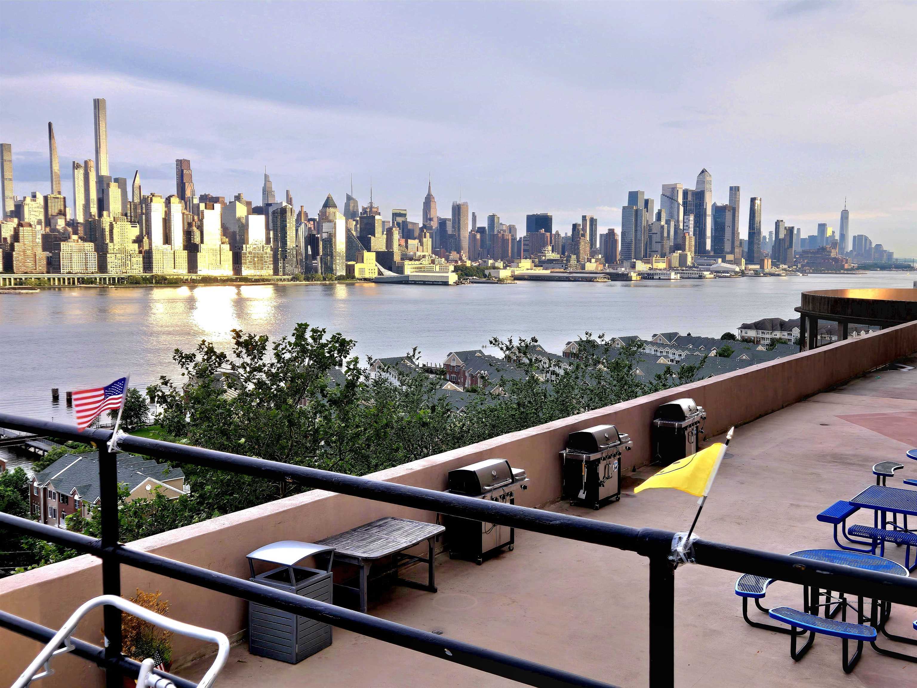 6600 Boulevard East, Unit 15D West New York, NJ 07093 - Photo 15 of 29 a view of swimming pool with outdoor seating and city view