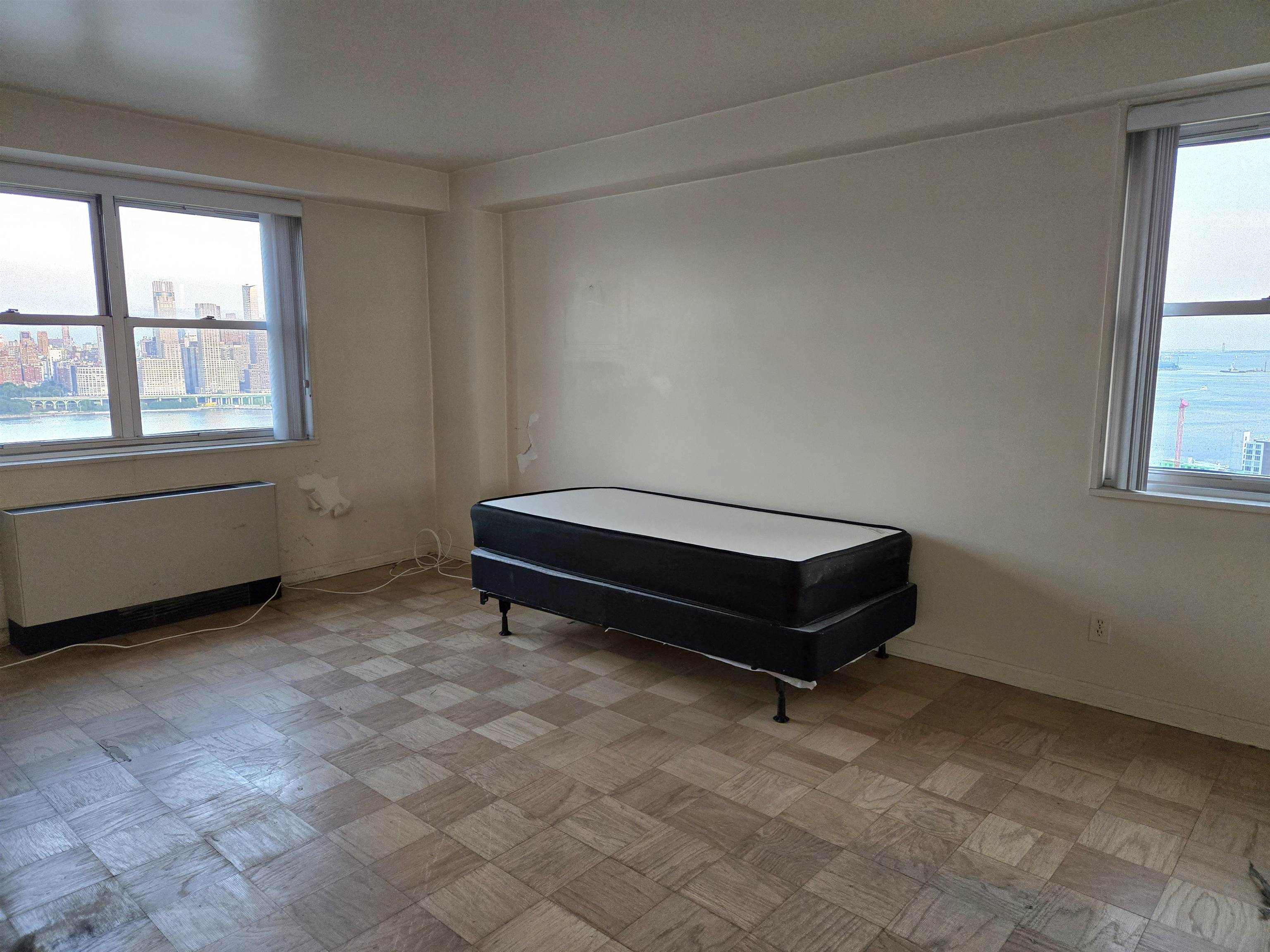 6600 Boulevard East, Unit 15D West New York, NJ 07093 - Photo 8 of 29 a room with a table and window