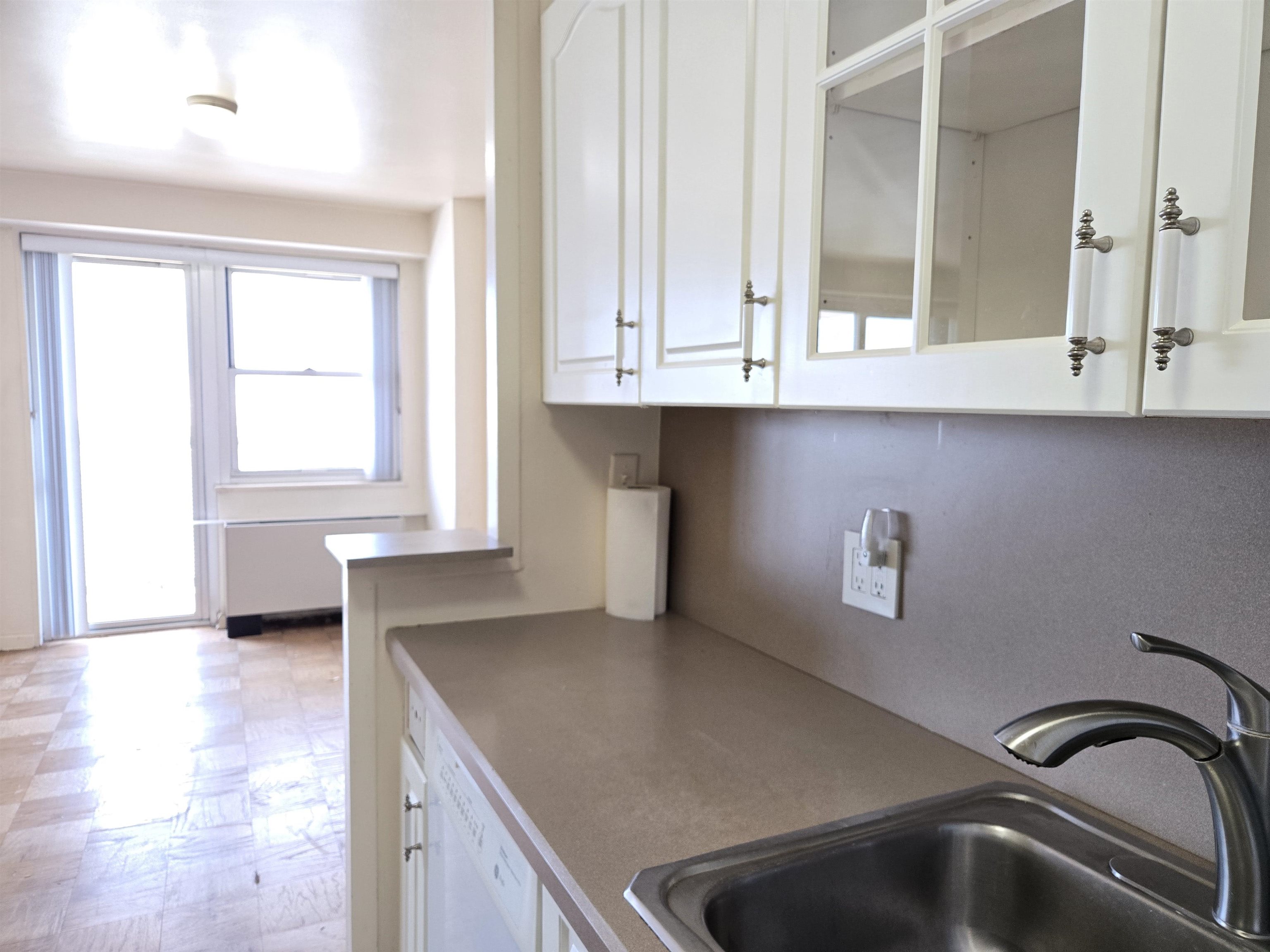 6600 Boulevard East, Unit 15D West New York, NJ 07093 - Photo 10 of 29 a kitchen with a sink cabinets and window