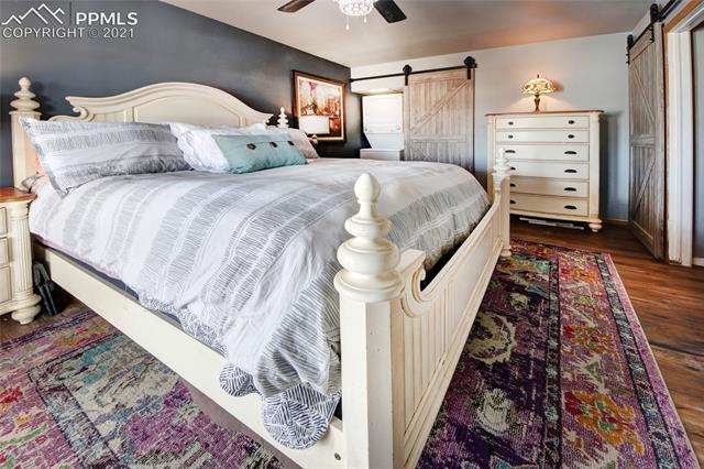 8084 Oliver Road Peyton, CO 80831 - Photo 13 of 33 A master bedroom with it's very own washer and dryer!!!!