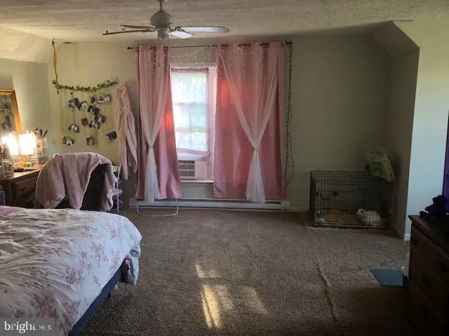 a bedroom with a bed and a chair