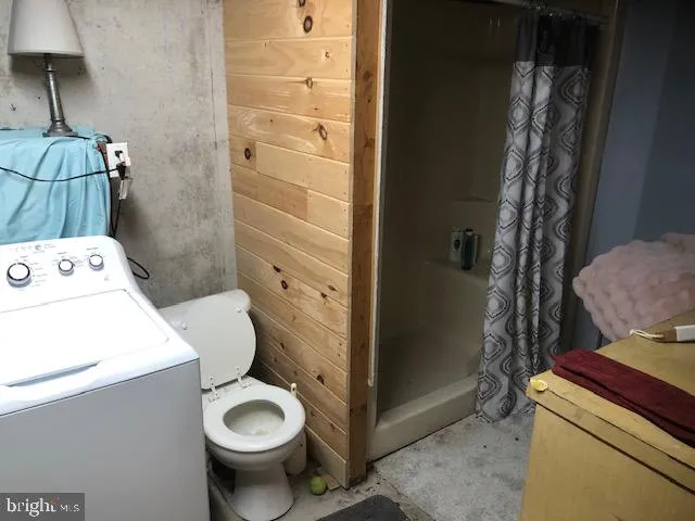 a bathroom with a toilet and a sink