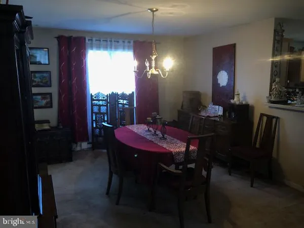a view of a dining room with furniture and window